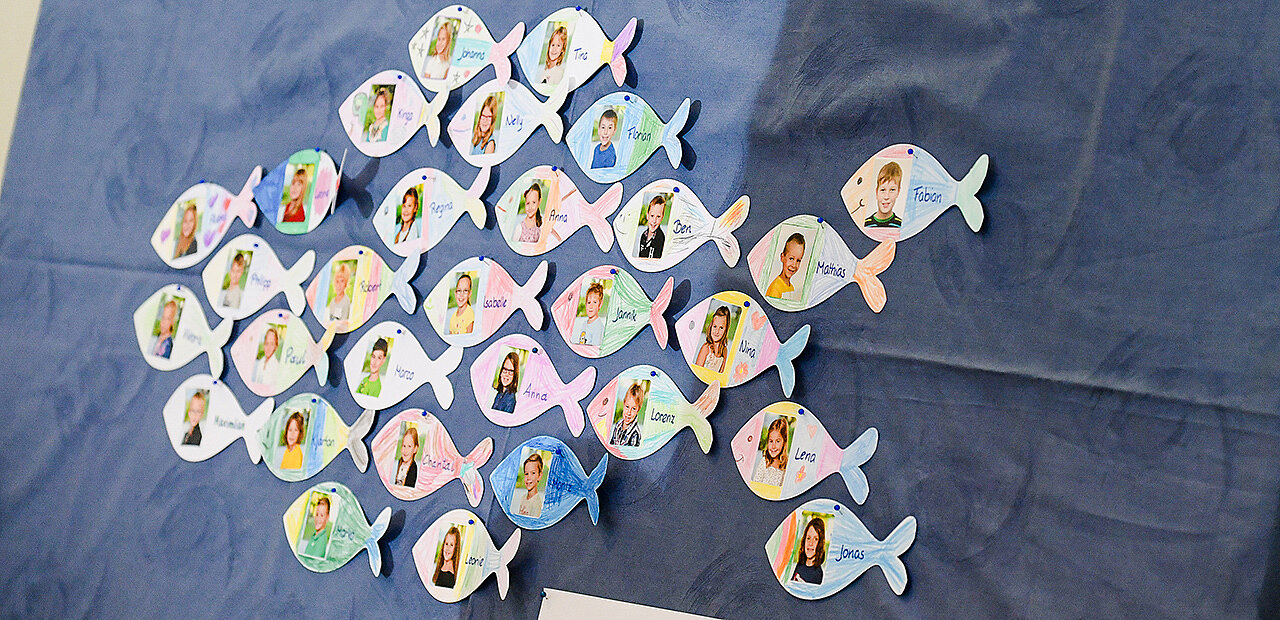 Auscgeschnitten Kinderfotos in Fischform.